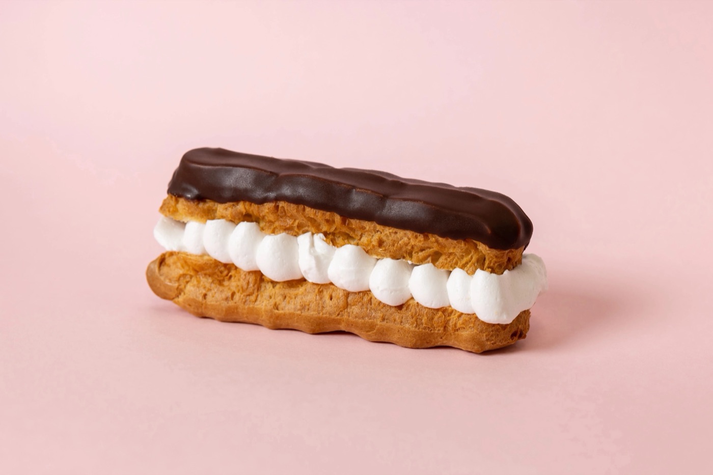 Eclair filled with whipped cream